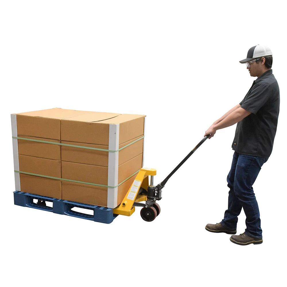 Worker using pallet jack with Regenesis composite pallet loaded with cargo