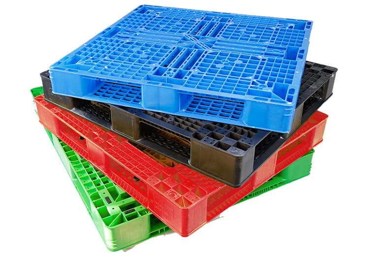 Multi-color Regenesis composite pallets stacked for reuse and recycling